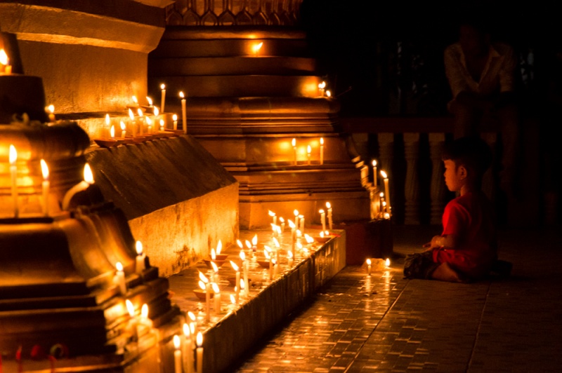 Top Myanmar Destinations: The Best Places to Visit in Myanmar: Child at a candle-lit pagoda, 1,000 Lights Festival, Myanmar by Wandering Wheatleys