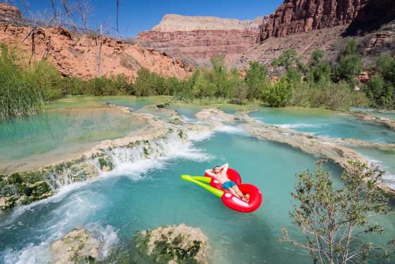 Floating at the top of Navajo Falls, Arizona by Wandering Wheatleys