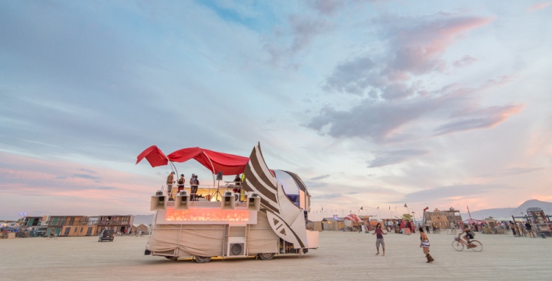 Burning Man First Time: Burning Man Tips for First-Timers: Art car at sunset at Burning Man by Wandering Wheatleys