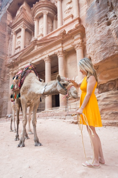 Guide to the Lost City of Petra, Jordan: Petting a camel at the Treasury, Petra, Jordan by Wandering Wheatleys