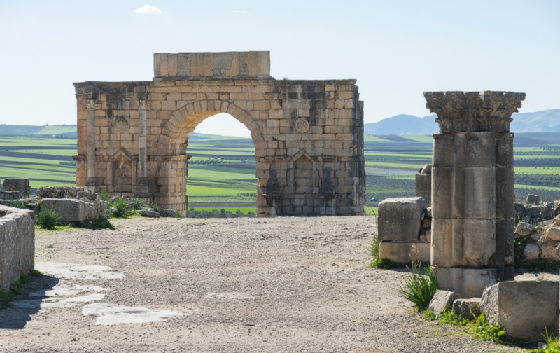 Triumphal Arch at Volubilis, Morocco by Wandering Wheatleys