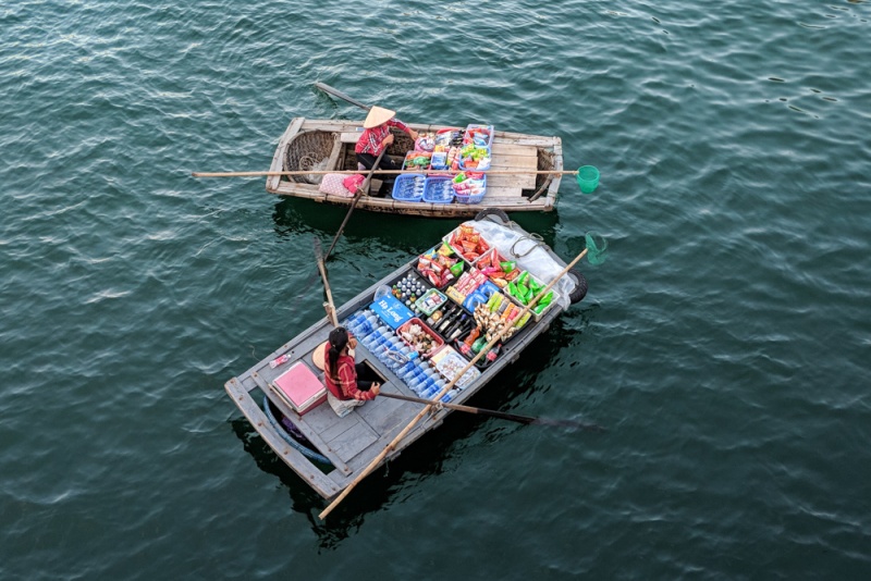 Choose the Best Halong Bay Cruise: Boat Ladies Selling Sundries