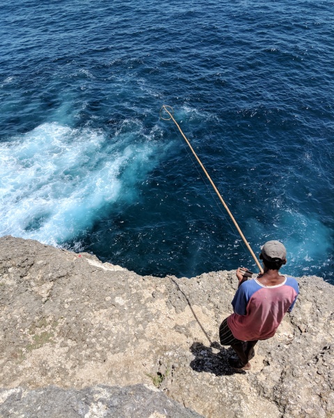 Guide to Nusa Penida Island, Bali - Things to Know & Tips for Visiting: Fisherman at Broken Beach
